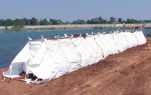 Dam bags for flood control at construction project near water